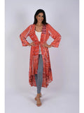 Woman wearing red boho blockprint cover-up with tie-front closure, front view