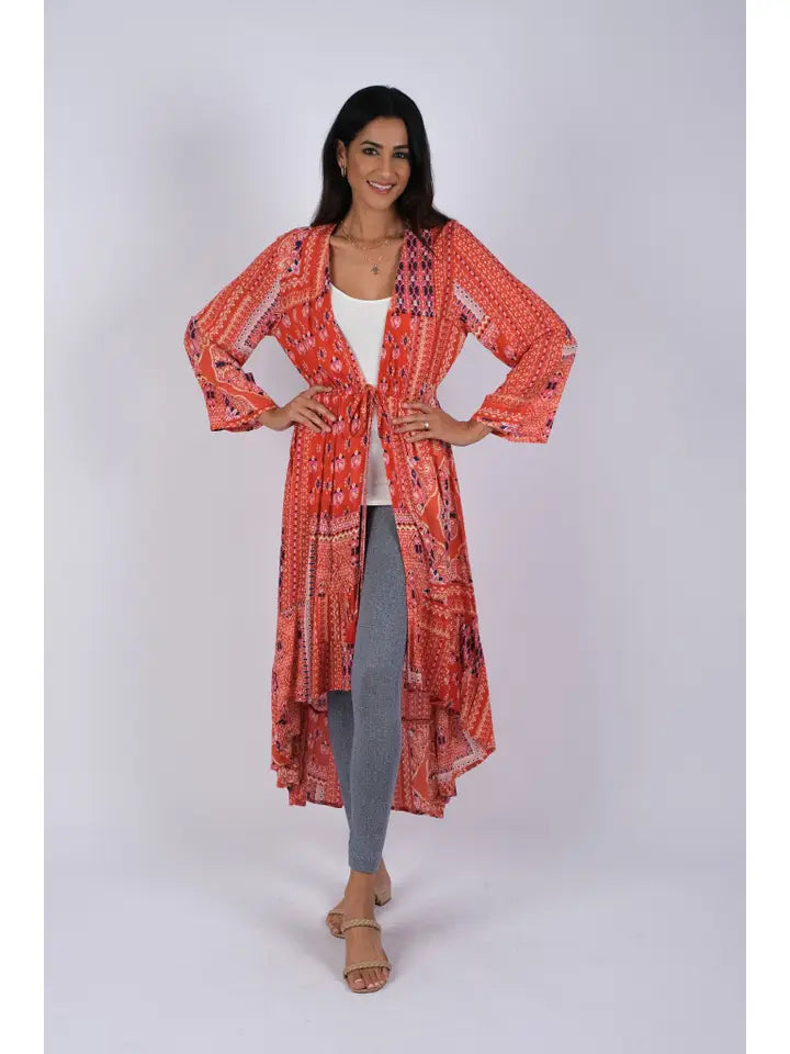 Woman wearing red boho blockprint cover-up with tie-front closure, front view