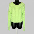 Neon green sweater on a mannequin against a gray background