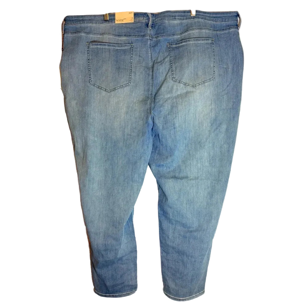 Blue jeans hanging on a wooden surface