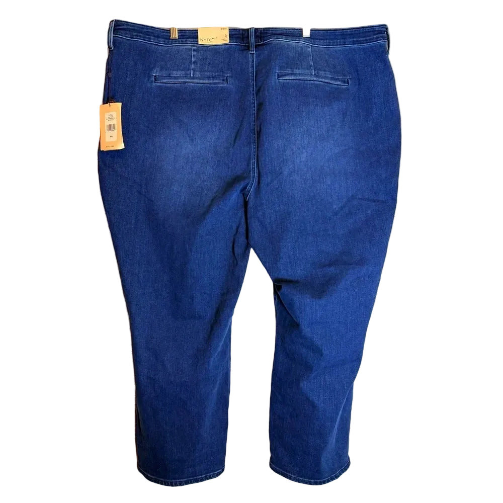 Blue jeans with a tag on a wooden surface