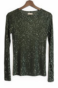 Black sequin sweater on a hanger against a white background