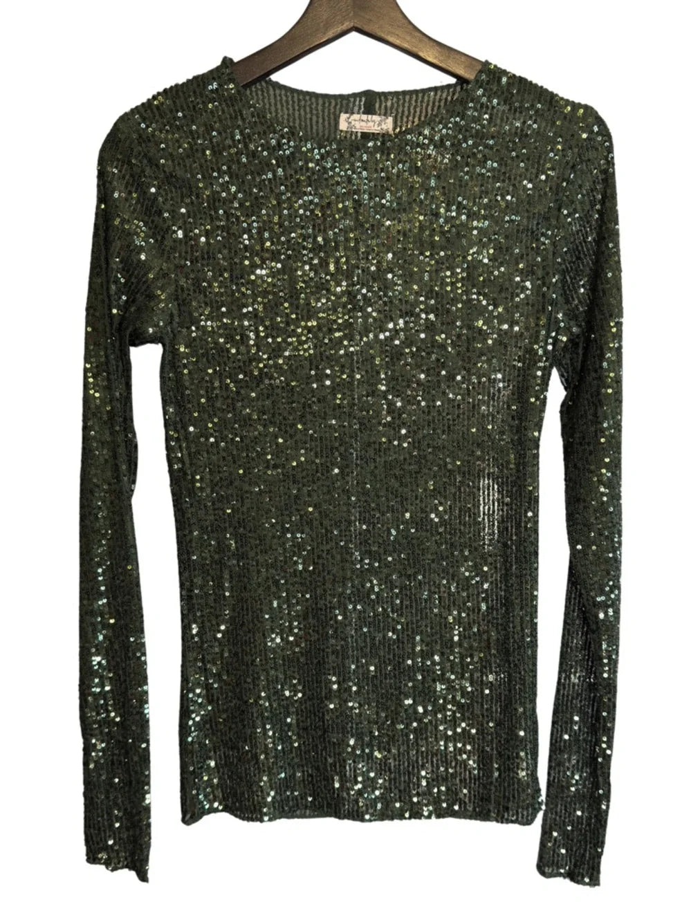 Black sequin sweater on a hanger against a white background