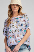 Woman wearing a light purple t-shirt with owl pattern on a white background
