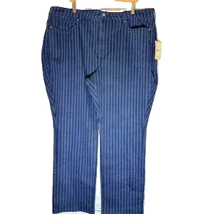 Blue striped pants on a wooden hanger against a light wooden panel background