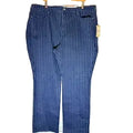 Blue striped pants on a wooden hanger against a light wooden panel background