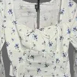Wild Fable white and blue floral crop blouse front view on hanger